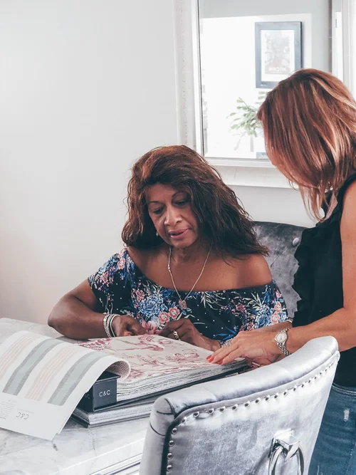 Lisa Gershinson consulting with a client at Ruler Interior Design